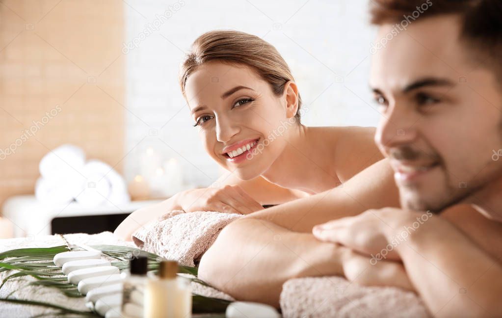 Romantic young couple relaxing in spa salon