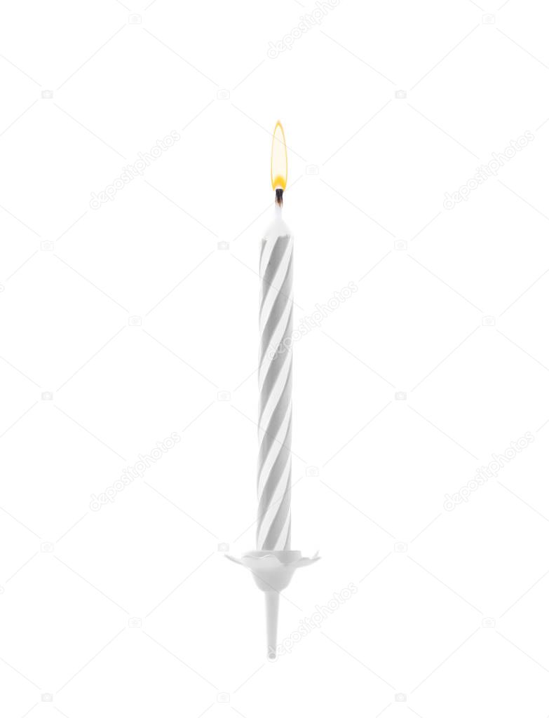Color birthday cake candle on white background