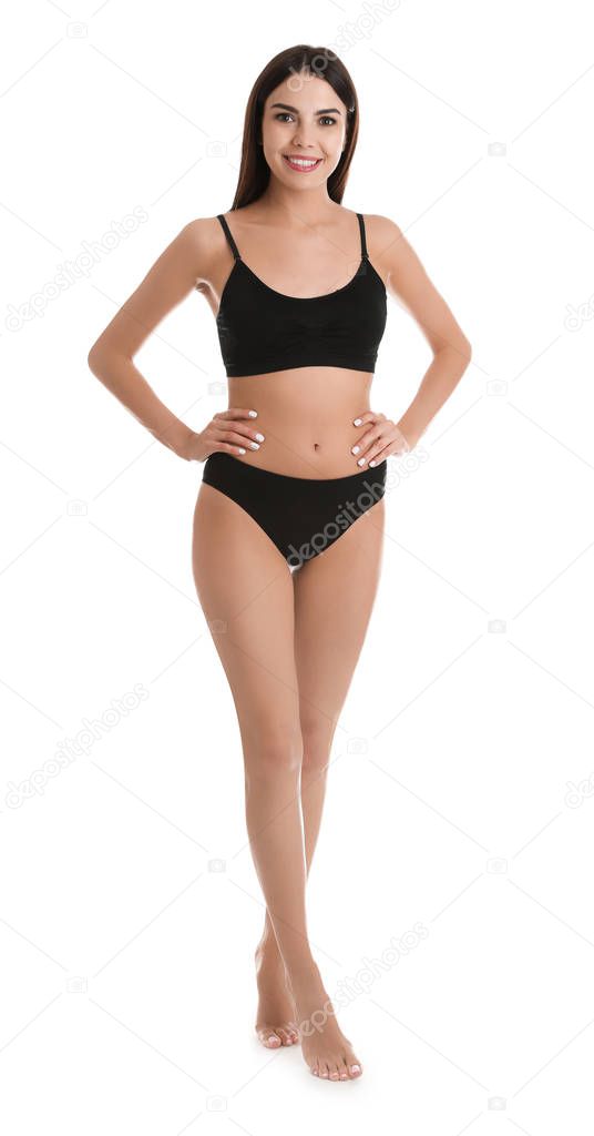 Full length portrait of attractive young woman with slim body in underwear on white background