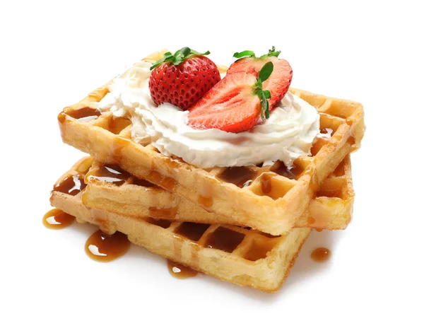 Yummy waffles with whipped cream, strawberries and caramel syrup on white background — Stock Photo, Image