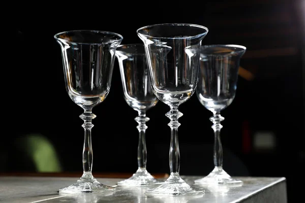 Empty clean glasses on counter in bar — Stock Photo, Image