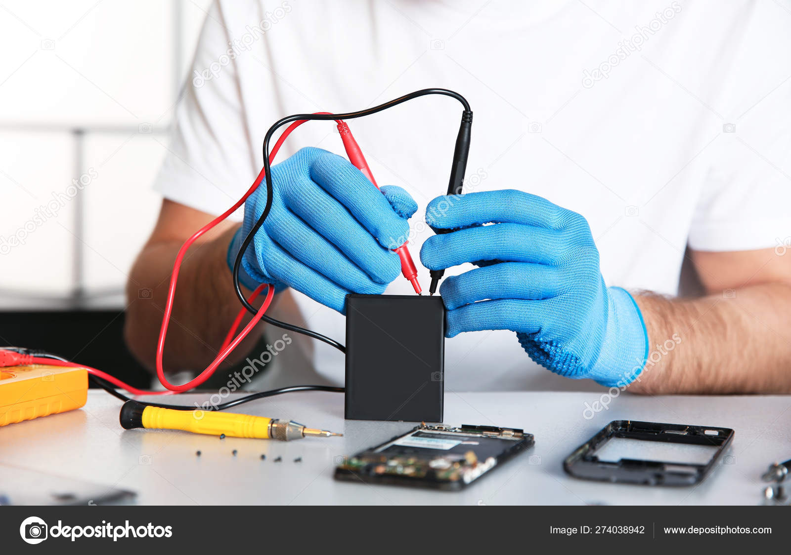 Technician Checking Mobile Phone Battery At Table In Repair Shop Closeup Stock Photo Image By C Liudmilachernetska Gmail Com 274038942