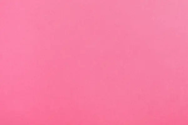 Pink paper sheet as color background, top view