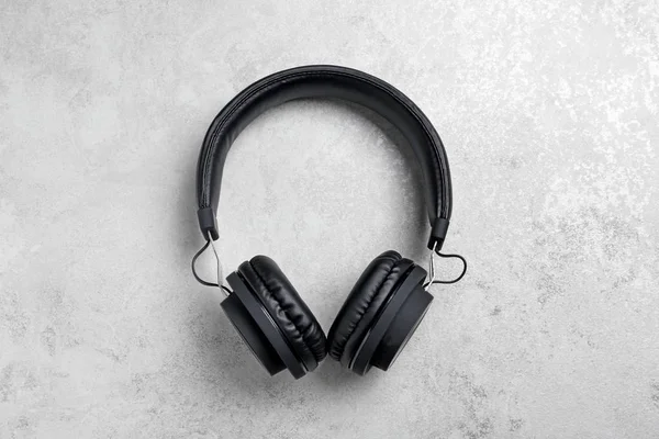 Stylish headphones on grey background, top view — Stock Photo, Image