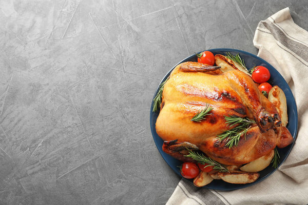 Delicious roasted turkey on table, top view. Space for text
