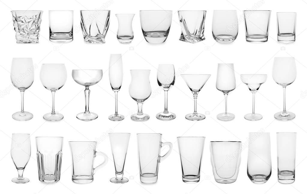 Set of different empty glasses on white background