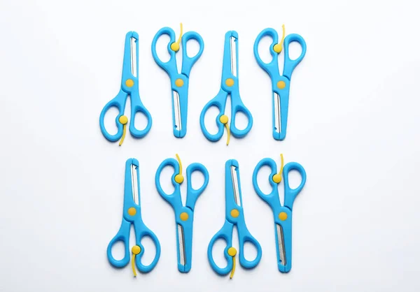 Set of training scissors on white background, top view — Stock Photo, Image