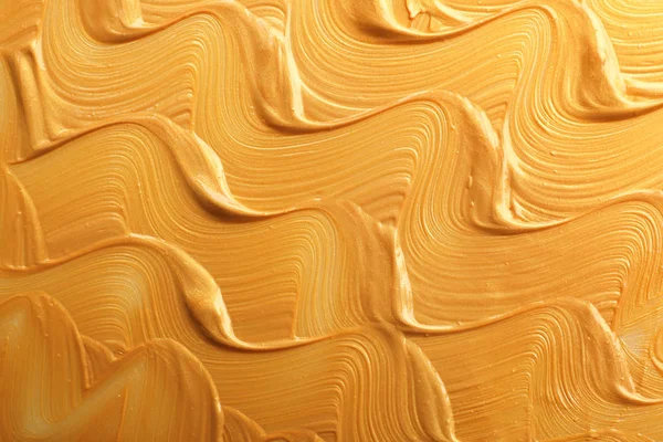 Tracce di vernice dorata come sfondo, vista dall'alto — Foto Stock