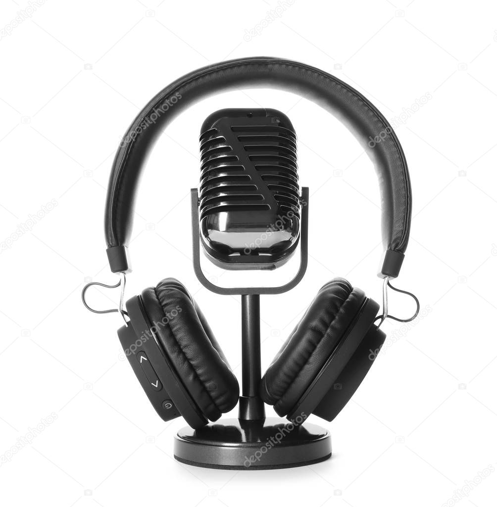 Retro microphone and headphones on white background