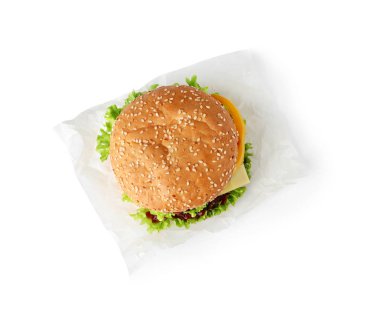 Beyaz, üst görünümde izole lezzetli taze Burger ile parşömen