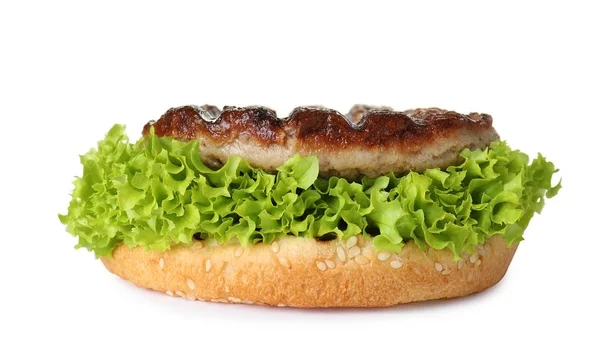 Burger bun with lettuce and cutlet isolated on white — Stock Photo, Image