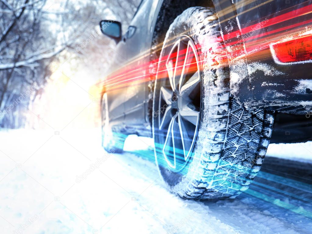 Modern car on snowy country road, closeup. Design with light effects