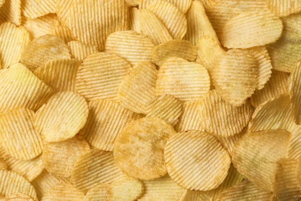 Batatas fritas crocantes como fundo, vista superior — Fotografia de Stock
