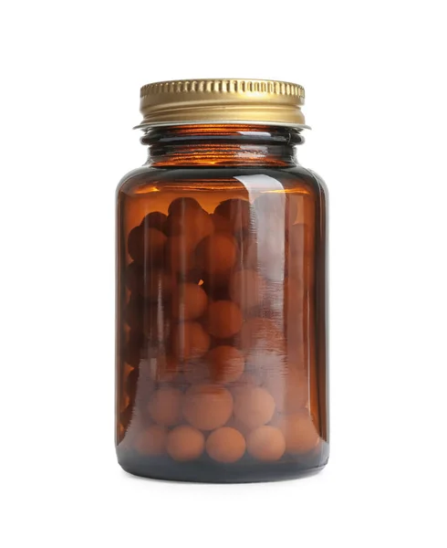 Fles met vitamine pillen op witte achtergrond — Stockfoto