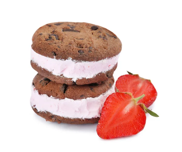 Sweet delicious ice cream cookie sandwiches and strawberry on white background