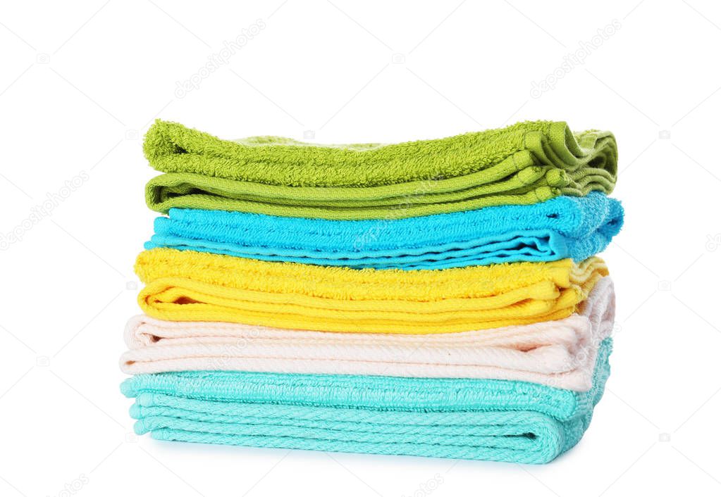 Stack of folded towels on white background