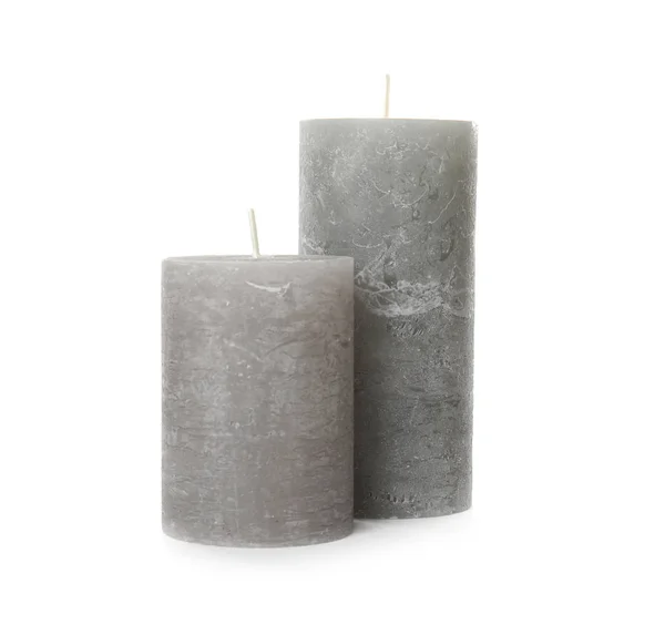 Duas velas de cera de cor no fundo branco — Fotografia de Stock