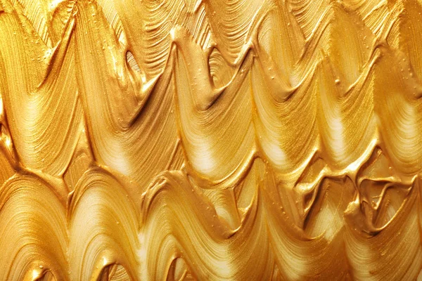Uderzeń złota farby jako tło, widok z góry — Zdjęcie stockowe