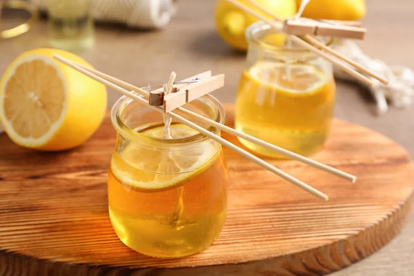 Process of making citrus candles on table