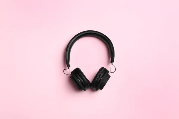 Stylish headphones on color background, top view — Stock Photo, Image