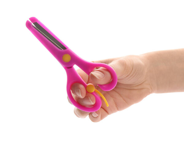 Woman holding training scissors on white background, closeup