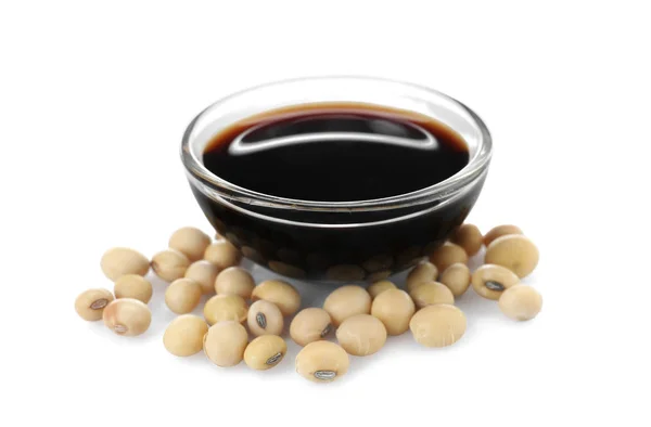 Bowl of tasty soy sauce and beans isolated on white Stock Picture