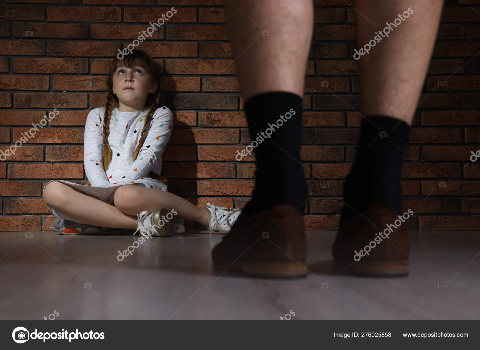 Adult man without pants standing in front of scared little girl