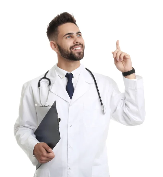 Young male doctor in uniform with clipboard isolated on white — 스톡 사진