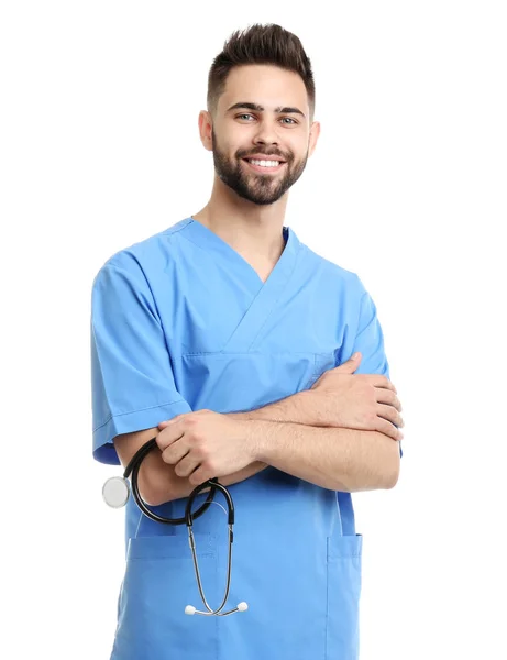 Joven médico en uniforme aislado en blanco — Foto de Stock