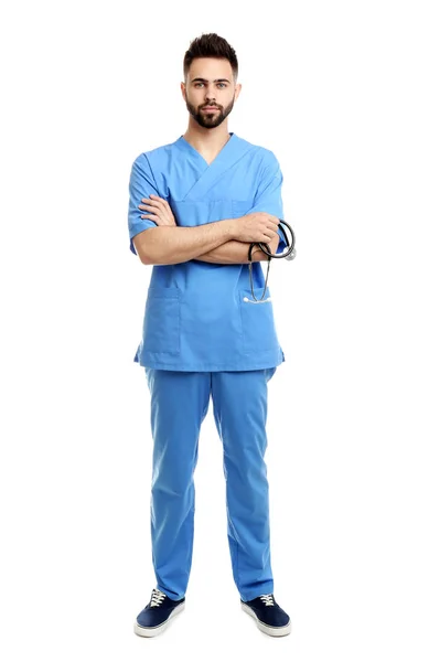 Young male doctor in uniform isolated on white — Stock Photo, Image