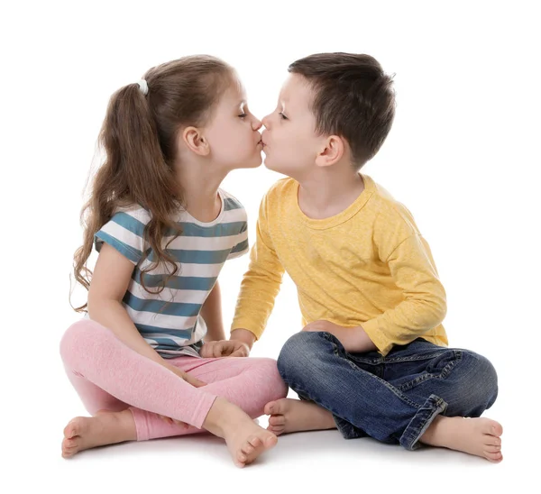 Cute little boy and girl kissing on white background Royalty Free Stock Photos