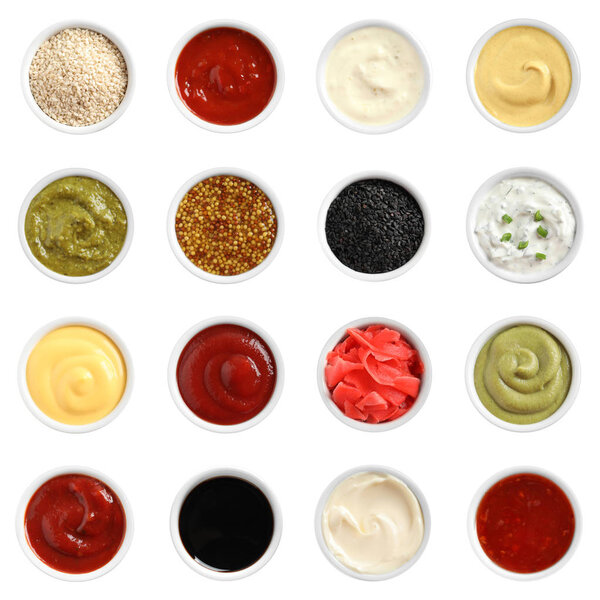 Set of different delicious sauces on white background, top view
