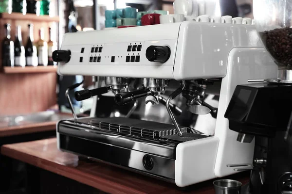 Modern coffee machine on bar counter in cafe — Stock Photo, Image