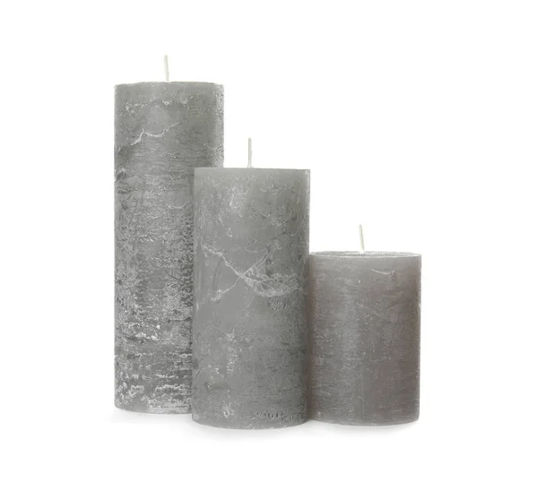 Três velas de cera de cor no fundo branco — Fotografia de Stock