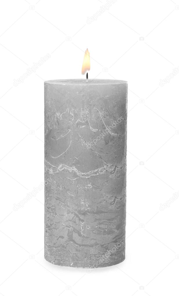 One alight wax candle on white background