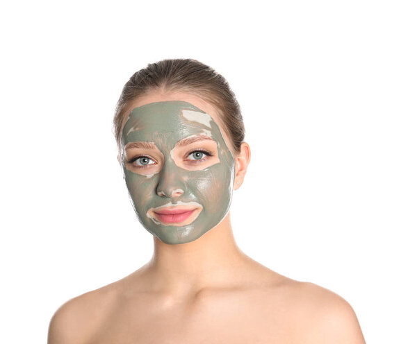 Beautiful woman with clay mask on her face against white background
