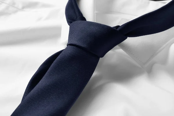 Black male necktie on white shirt, closeup — Stock Photo, Image
