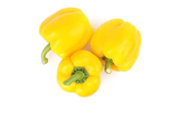 Ripe yellow bell peppers isolated on white, top view — Stock Photo, Image