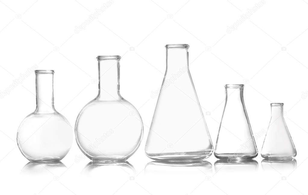 Group of empty chemistry glassware isolated on white