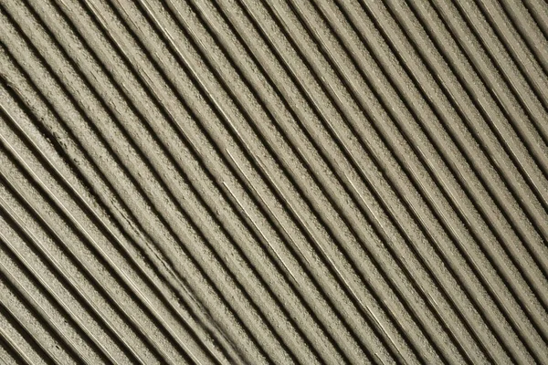 Lined grey concrete as background, top view. Tile installation — Stock Photo, Image