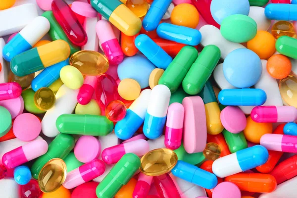 Vegyes tabletták háttér, felülnézet. Gyógykezelés — Stock Fotó