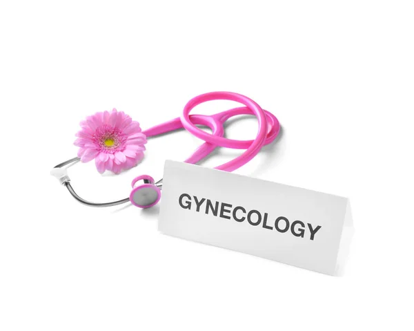Kortti sanalla Gynekologia, kukka ja stetoskooppi valkoisella taustalla — kuvapankkivalokuva