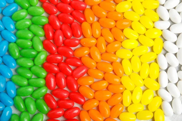 Deliciosos grãos de geleia de cores diferentes, close-up — Fotografia de Stock