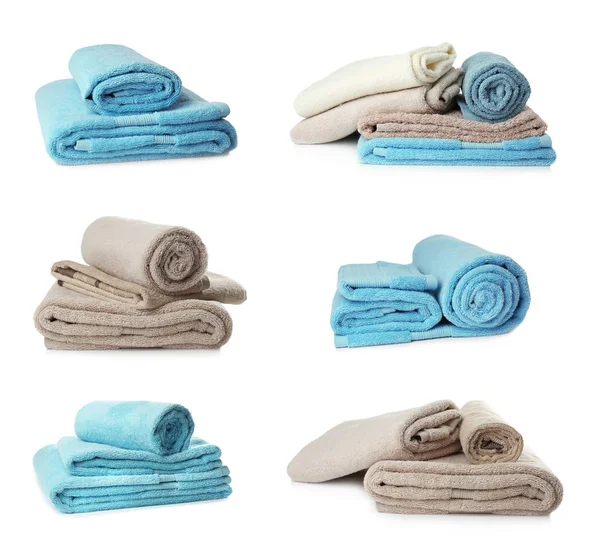 Conjunto de diferentes toallas de rizo suave sobre fondo blanco, vista superior — Foto de Stock