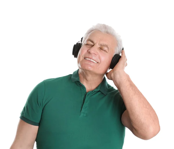 Mature man enjoying music in headphones on white background — Stock Photo, Image