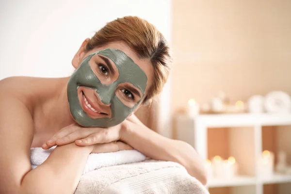 Beautiful woman with mask on face relaxing in spa salon. Space for text — Stock Photo, Image