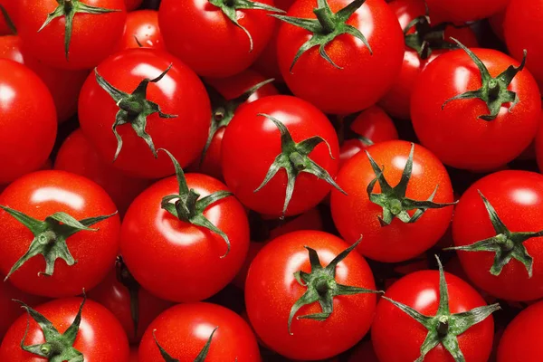 Köstliche reife Kirschtomaten als Hintergrund, Draufsicht — Stockfoto