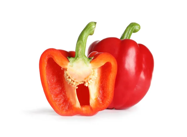 Cut and whole ripe red bell peppers on white background — Stock Photo, Image