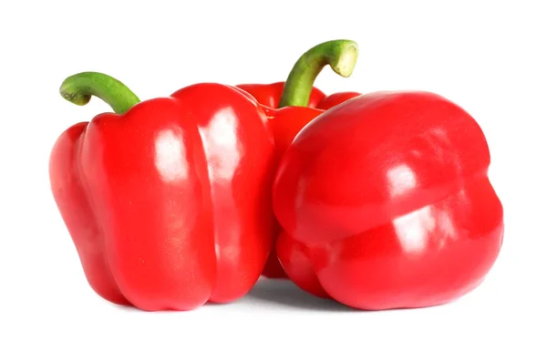Tasty ripe red bell peppers on white background — Stock Photo, Image