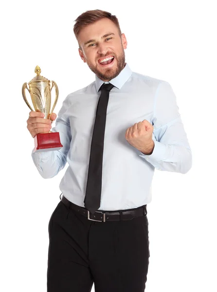 Portrait of happy young businessman with gold trophy cup on white background — Stock Photo, Image